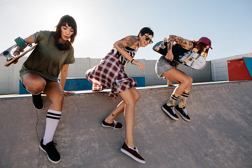 Female skaters having fun at skate park