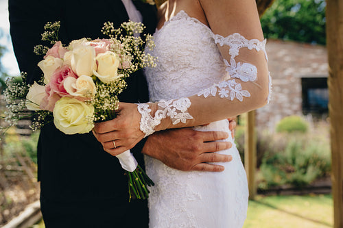 Couple standing together on their wedding day