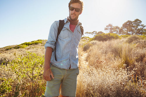 Handsome young man hiking in nature