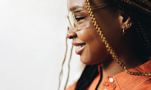 Young woman smiling cheerfully indoors