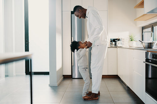 Man playing a game with his young daughter in the morning