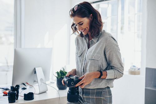 Female photographer working in her office