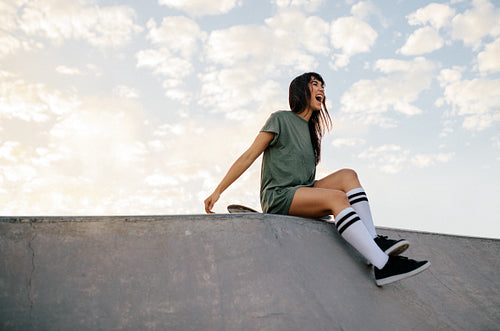 Woman enjoying a day at skate park