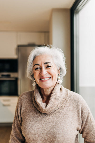 Happy senior woman smiling at the camera