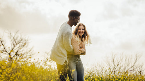 Couple enjoying themselves in the meadow 