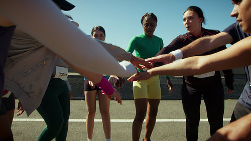 Runners demonstrate unity before a race