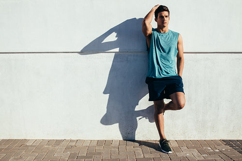 Sportsman relaxing after running exercise