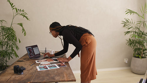 Female photographer working in her home office