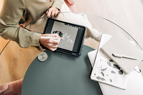 Creative businesswoman drawing on a digital tablet