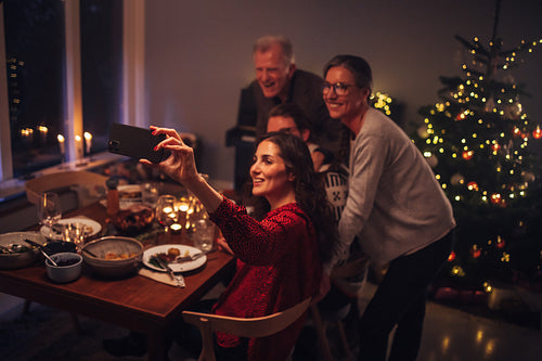 Family doing video call during Christmas dinner