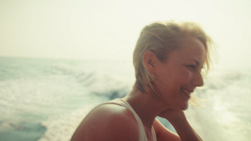 Woman smiling with gratitude while enjoying a family yacht cruise