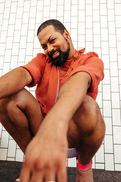Happy young drag queen smiling at the camera