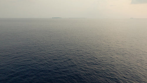 Ocean horizon with distant small islands