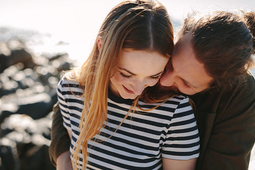 Couple enjoying each other's company on beach