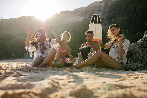 Happy friends enjoying vacation on the beach.