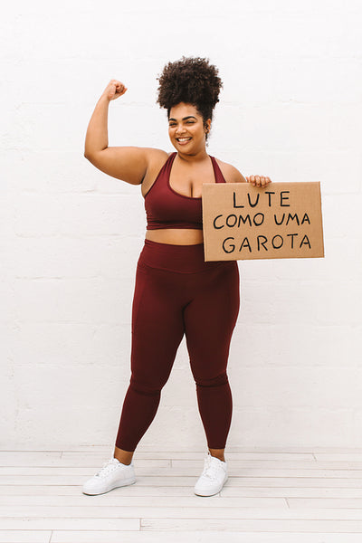 Pretty woman with "Fight like a girl" sign