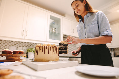 Woman confectioner in kitchen