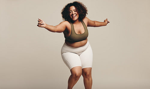 Woman in sports clothing doing some fun dance moves