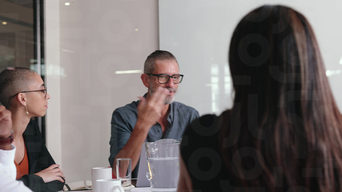 Senior Collaborative Collaborative planning: Senior business man discussing with his team i ...