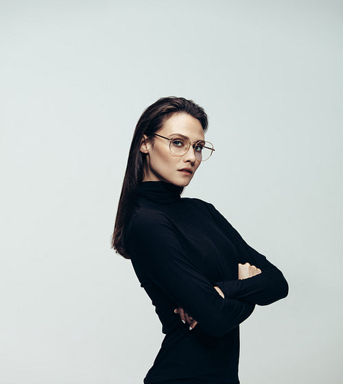 Attractive woman in glasses wearing black dress