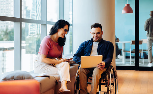 Collaborating friends in a modern office lounge