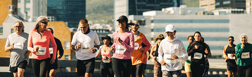 Group of runners participating in a city marathon event