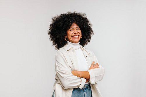 Gorgeous woman with an Afro hairstyle smiling at the camera
