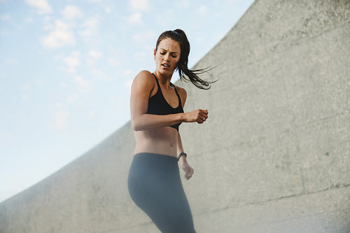 Woman exercising outdoors in morning