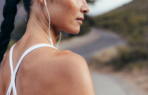 Woman listening to music during workout