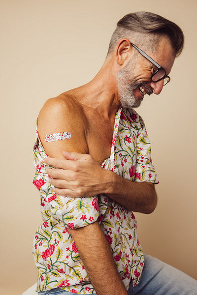 Mature man after getting covid-19 vaccine