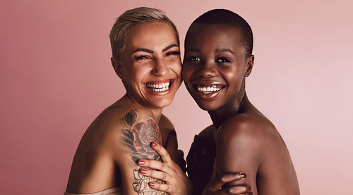 Diverse female models smiling at camera