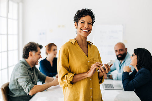 Professional woman using a mobile phone in an office