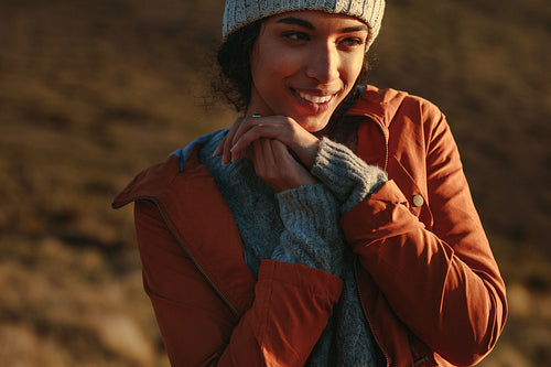 Woman standing on mountain on a winter day