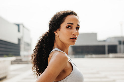 Portrait of fitness woman staring at camera
