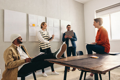 Happy business colleagues having a meeting in an office
