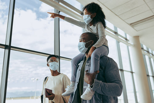 African family at airport in pandemic