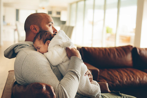 Little boy on his father's chest