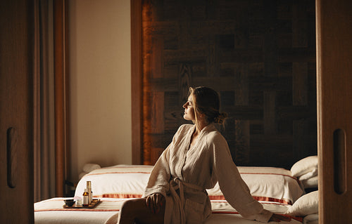 Woman enjoying a relaxing spa treatment at luxury hotel resort for a rejuvenating vacation
