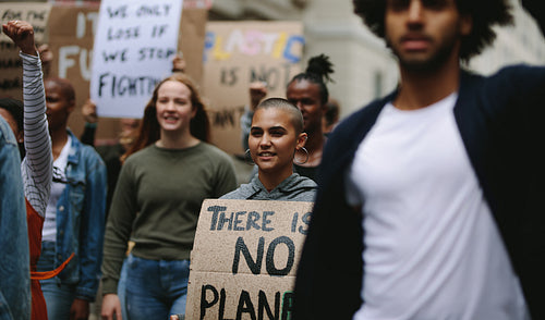 Group of activists marching and protesting in the city