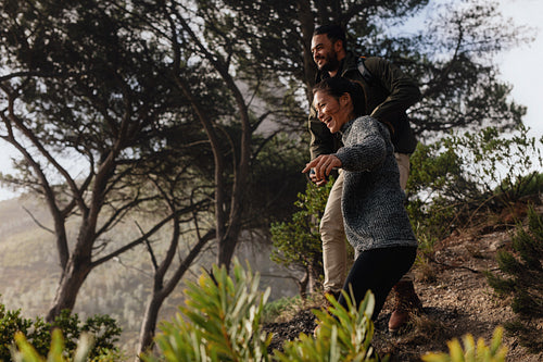 Young couple having fun on their hiking trip