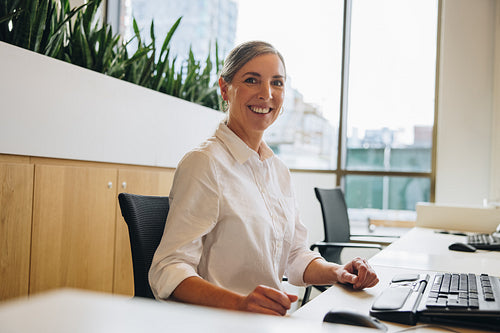 Cheerful businesswoman at work