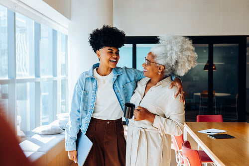 Business rapport: Colleagues reconnect during a break between meetings