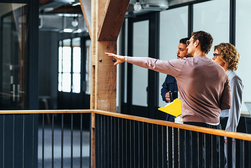 Business people discussing with an interior designer in an office