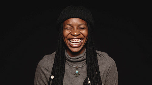 Happy african woman with long dreadlocks