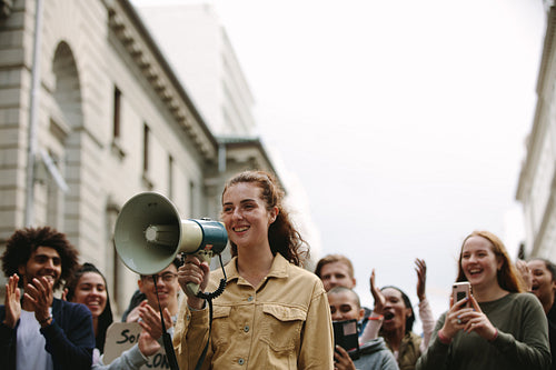Woman with group of people in a rally