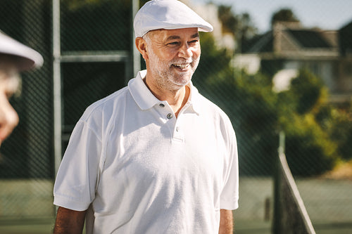 Portrait of  smiling senior man in tennis wear