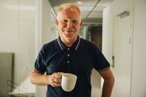 Entrepreneur having coffee break at work
