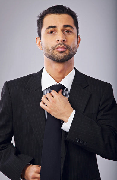 Corporate Man Fixing His Necktie