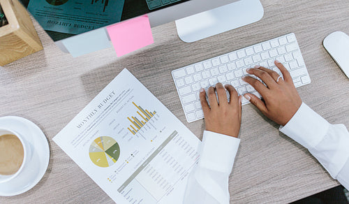 Female hands working at her desk