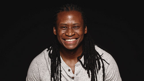 Smiling african man with dreadlocks